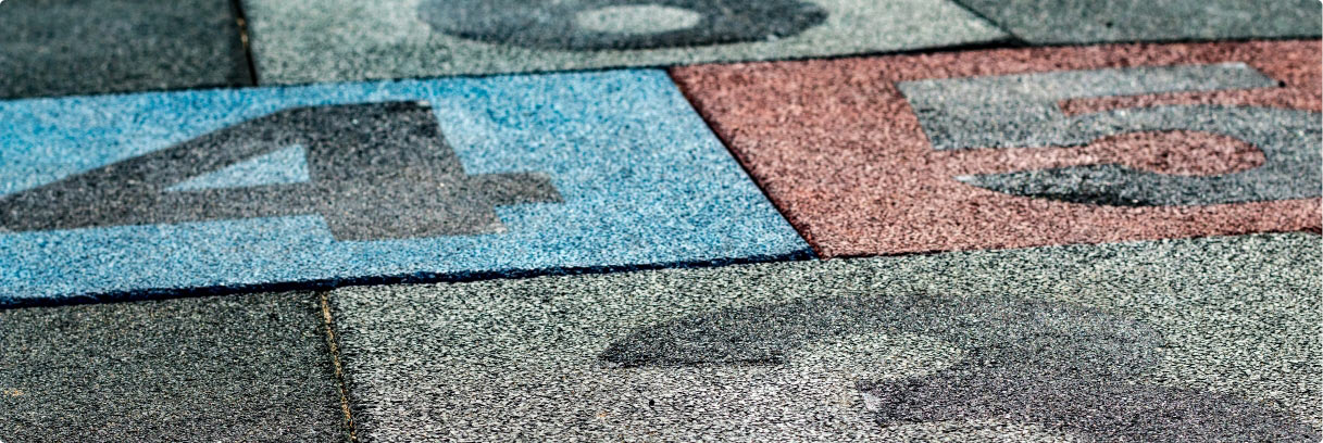 Interactive rubber tiles for playground flooring